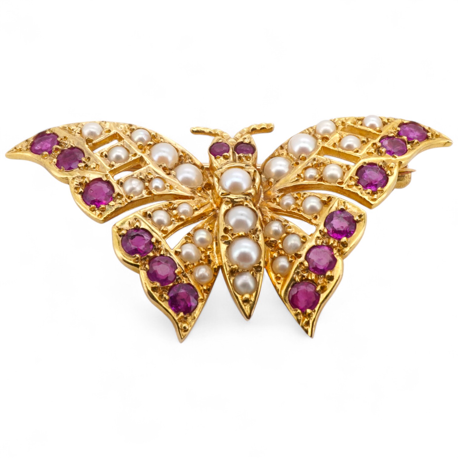A ruby and split pearl butterfly brooch, set with half pearls and circular-cut rubies, mounted in 9ct gold, wingspan 4cm, British hallmarks, gross weight approximately 6 grams, pearls untested